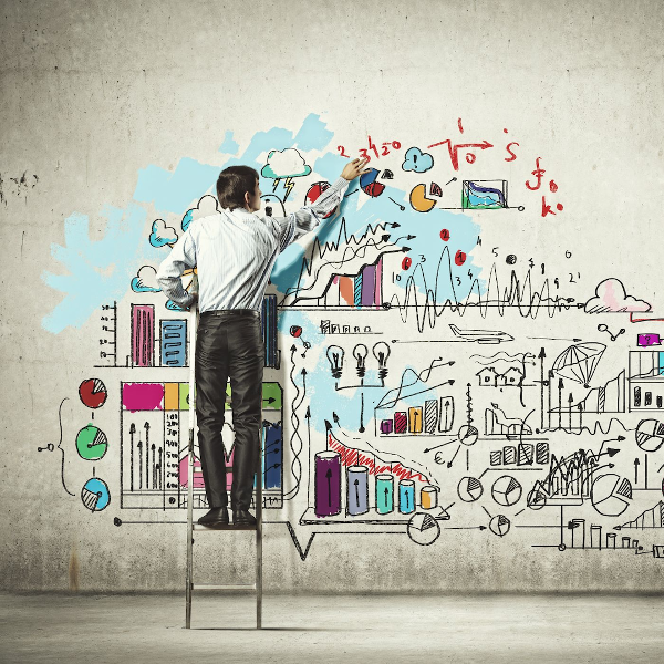 Man standing on ladder fixes wall with equations